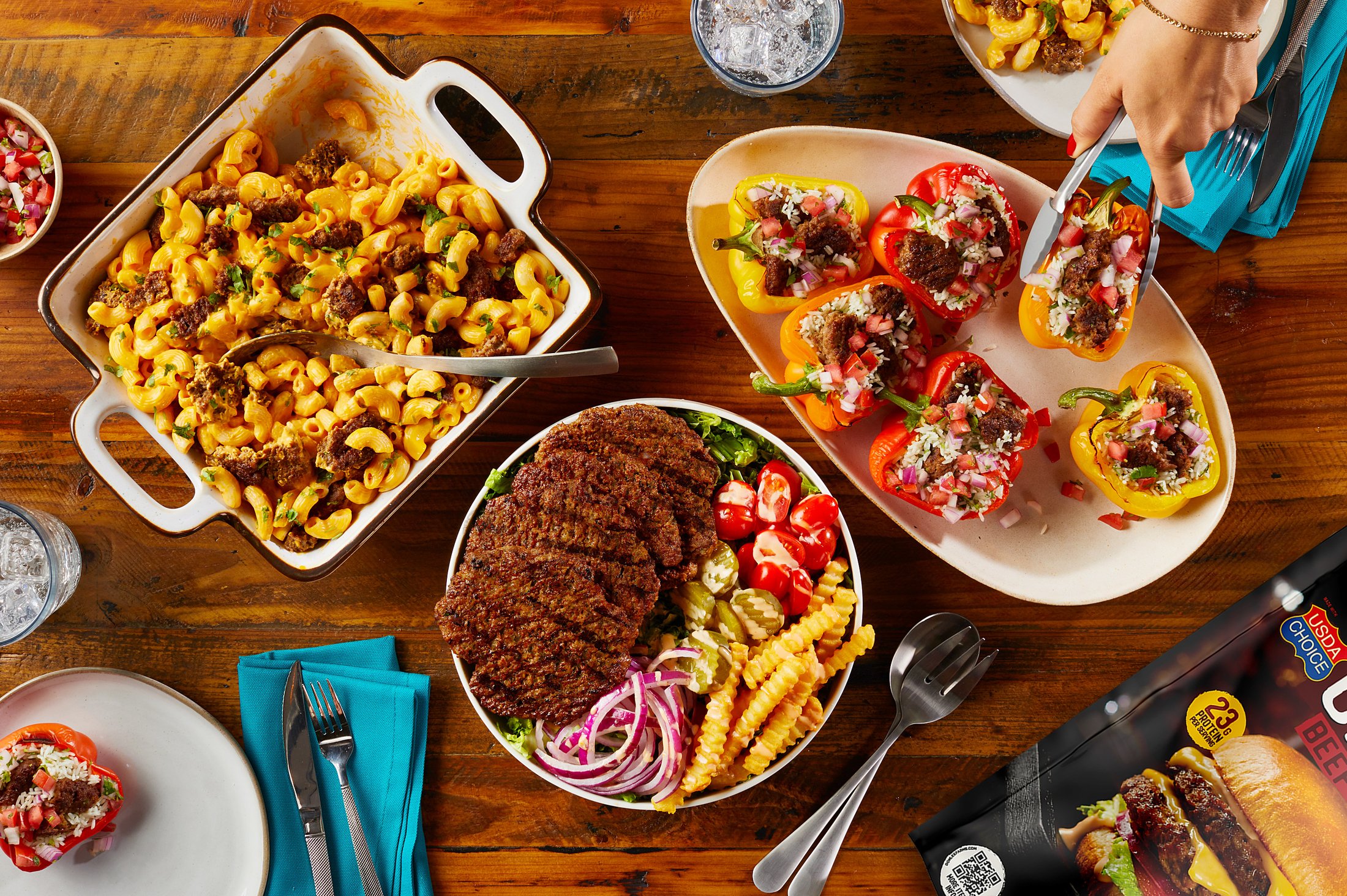 Game-day spread of chili mac, stuffed peppers and a loaded patty bowl