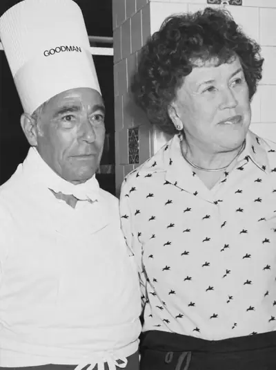 Larry Goodman in a chef's hat with Julia Child