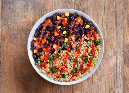 Black bean and quinoa bowl with red sauce